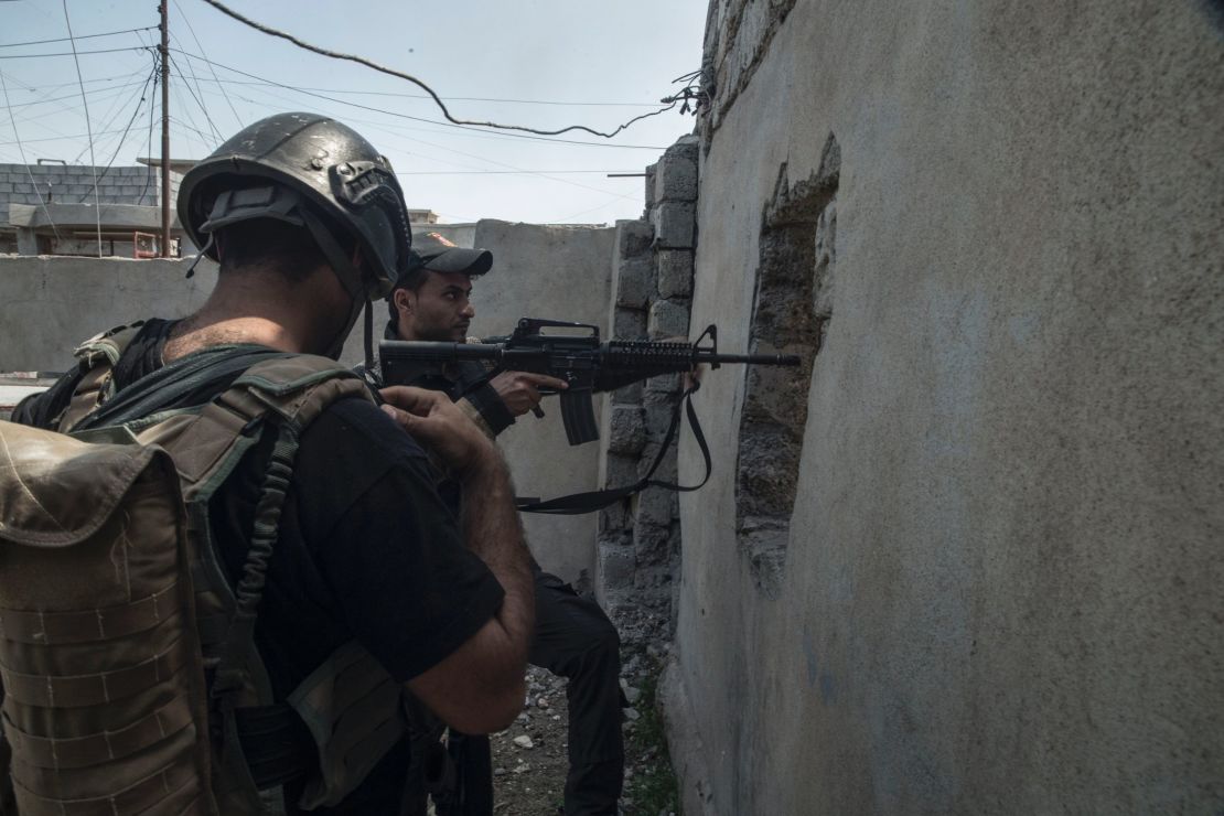 Soldiers from Iraqi special forces Golden Division conduct ground raids in west Mosul's al Tank neighborhood on April 17.