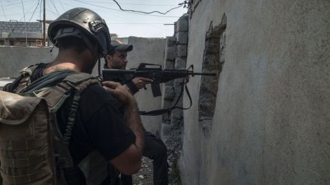 Soldiers from Iraqi special forces Golden Division conduct ground raids in west Mosul's al Tank neighborhood on April 17.