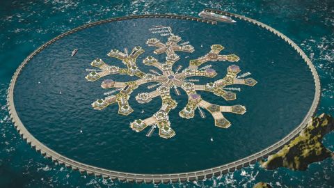 A modular wavebreaker shelters Artisanopolis, a model seastead, in shallow coastal waters. Greenhouse domes will provide locally grown food. Courtesy of Gabriel Scheare, Chile.