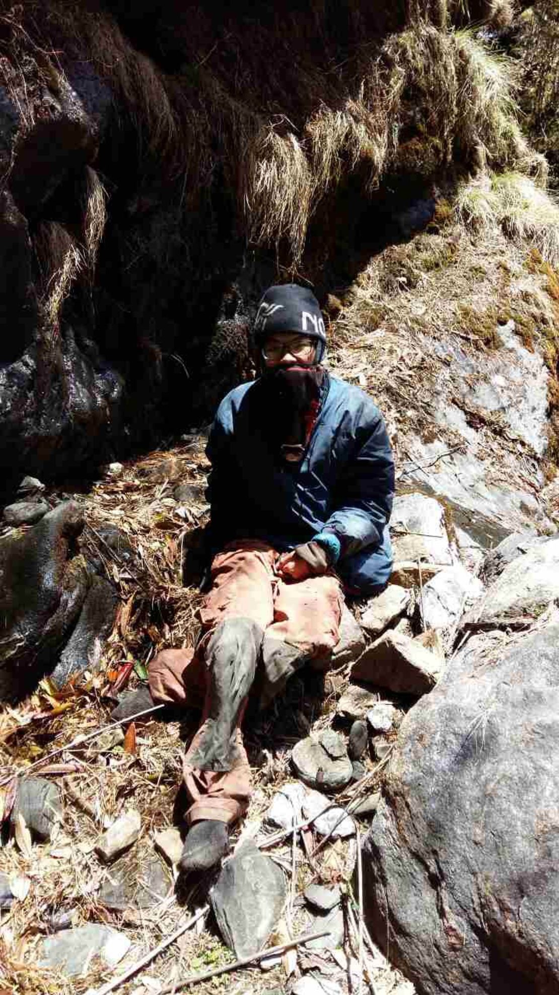 Taiwanese hiker Liang Sheng-yue, seen at the site of his rescue. He was conscious when the search party found him, but "very tired," and had lost 30 kg over the 47 days in the wilderness. 