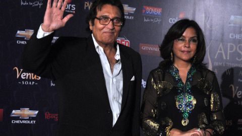 Bollywood actors Vinod Khanna and Zeenat Aman pose as they arrive for the "7th Apsara Awards" ceremony in Mumbai on January 25, 2012. 