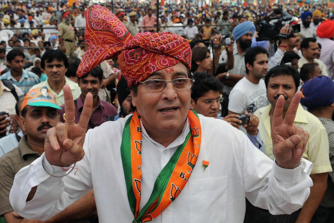 Vinod Khanna makes a victory sign during an election campaign rally on the outskirts of Gurdaspur, India.