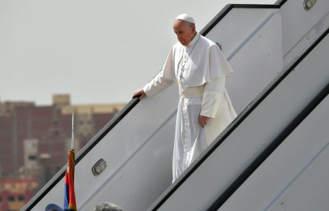 Pope Francis disembarks from his plane after arriving in Cairo.