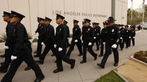 LAPD recruits march in processional as the Los Angeles Police Department holds a graduation ceremony led by LAPD Chief Charlie Beck and Mayor Eric Garcetti.