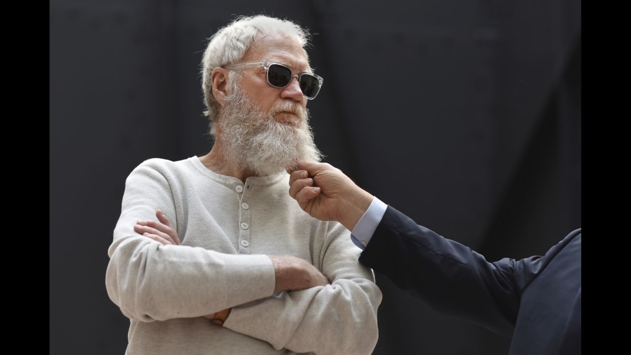 Former talk-show host David Letterman has his beard tugged by US Sen. Al Franken as they meet with climate-change activists in Washington on Friday, April 28.