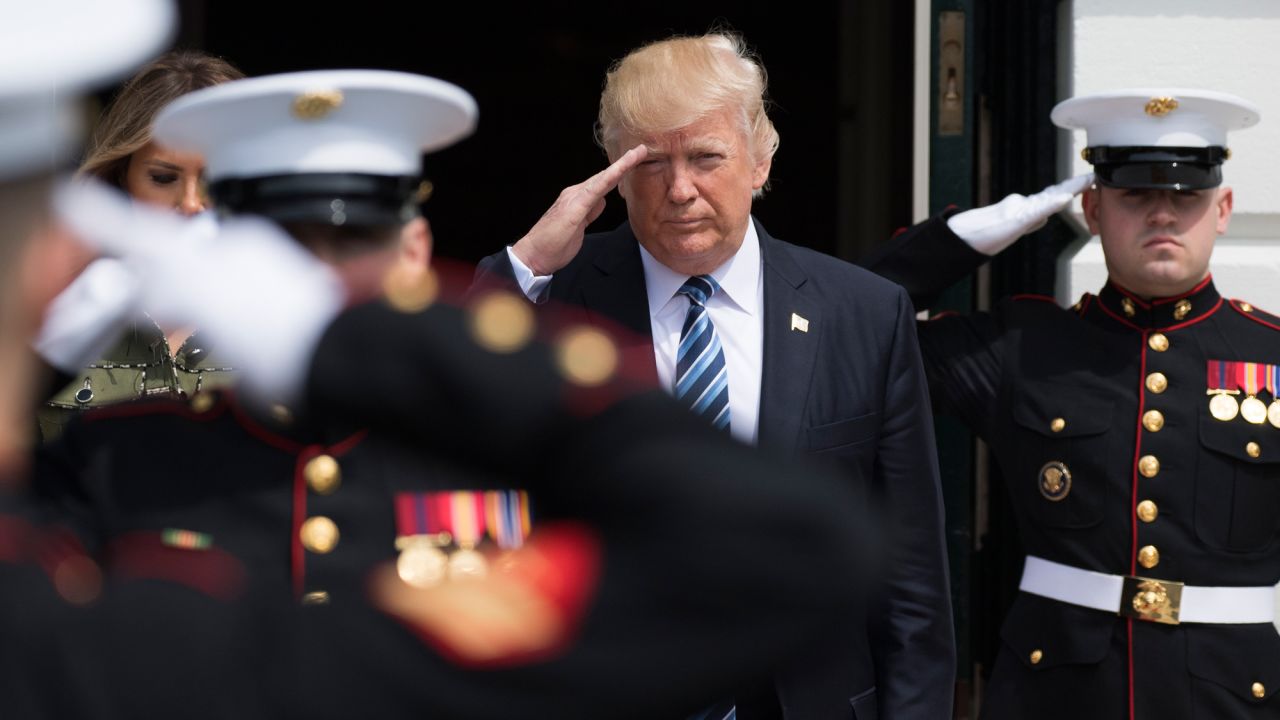 President Trump salutes US Marines at the White House as he and his wife walk out to greet Argentina's President on Thursday, April 27.