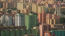 A photo taken on July 17, 2016 shows apartment buildings and the Monument to the Founding of the Workers Party (centre R) amongst the Pyongyang skyline, seen from a viewing deck of the landmark Tower of the Juche Idea. / AFP / KIM WON-JIN        (Photo credit should read KIM WON-JIN/AFP/Getty Images)
