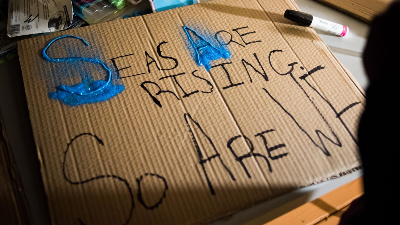 A sign is prepared before the march.