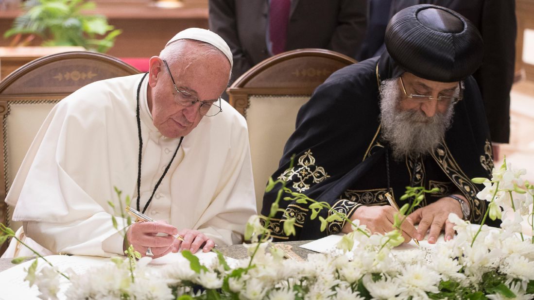 Francis and Pope Tawadros II, head of Egypt's Coptic Orthodox Church, sign a joint declaration reiterating the fraternity between their churches at Cairo's St. Mark's Cathedral. "Let us intensify our unceasing prayer for all Christians in Egypt and throughout the whole world, and especially in the Middle East," the declaration said on Friday, April 28.