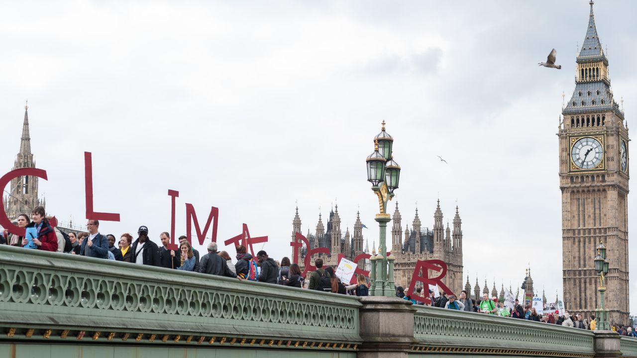 Activists form a symbolic human chain on Westminster Bridge in London.