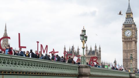 Activists form a symbolic human chain on Westminster Bridge in London.