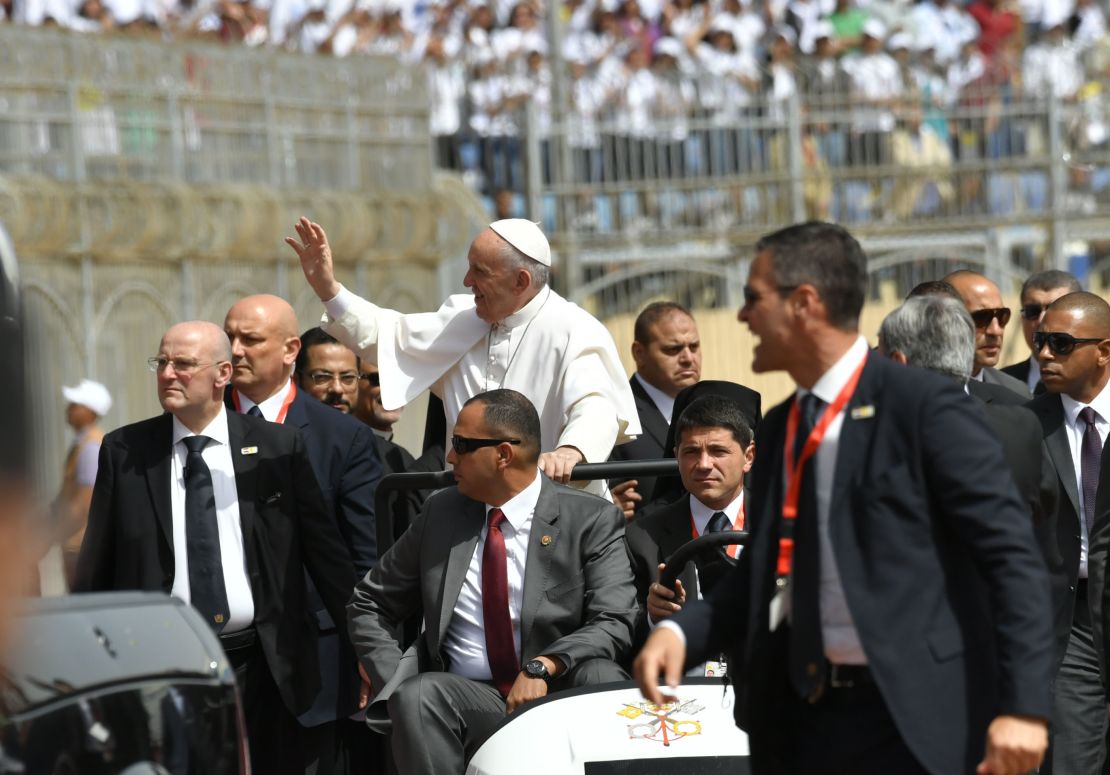 Security surrounds Pope Francis at the Air Defense Stadium in Cairo.