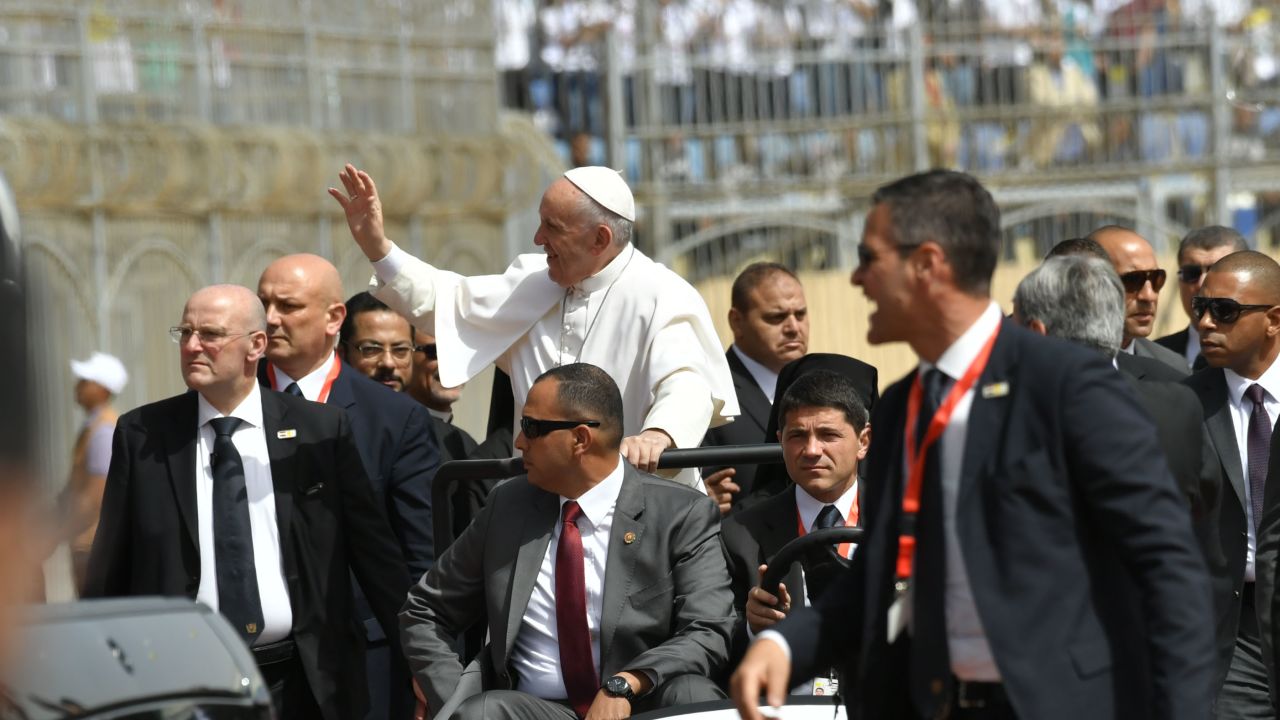 Security surrounds Pope Francis at the Air Defense Stadium in Cairo.