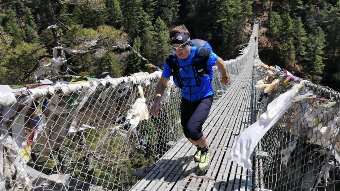 Steck crosses a bridge during a training run in Nepal's Khumbu Valley.