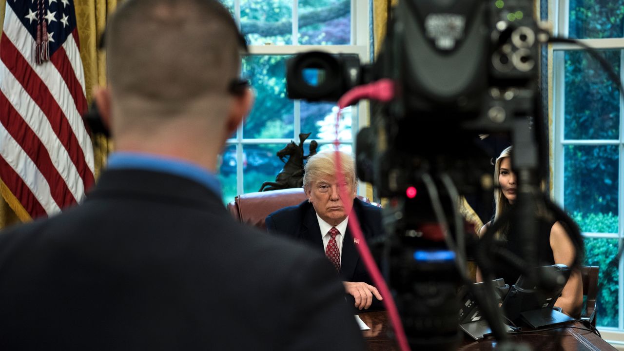 US President Donald Trump (C) and Ivanka Trump (R) listen while speaking via video with NASA astronauts aboard the International Space Station from the Oval Office of the White House April 24, 2017 in Washington, DC. / AFP PHOTO / Brendan Smialowski        (Photo credit should read BRENDAN SMIALOWSKI/AFP/Getty Images)