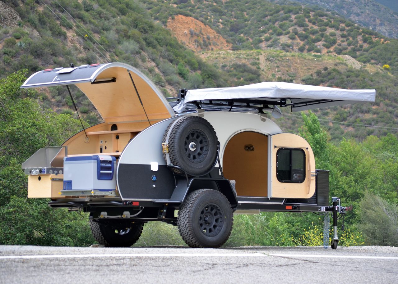 This modern twist on the traditional teardrop trailer, complete with a fully equipped kitchen and two-person sleeping quarters, can be customized with a variety of finishes and accessories. 