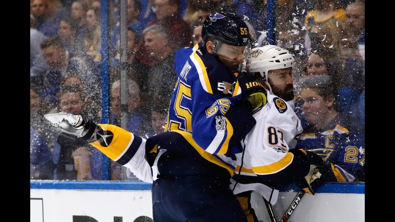 St. Louis defenseman Colton Parayko checks Nashville's Vernon Fiddler into the boards during an NHL playoff game on Friday, April 28.