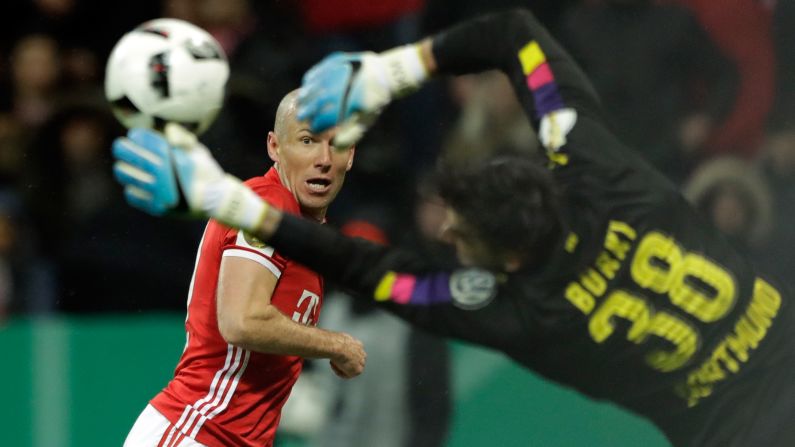 Bayern Munich's Arjen Robben tries to score past Dortmund goalkeeper Roman Burki during a German Cup semifinal on Wednesday, April 26. Dortmund won 3-2.