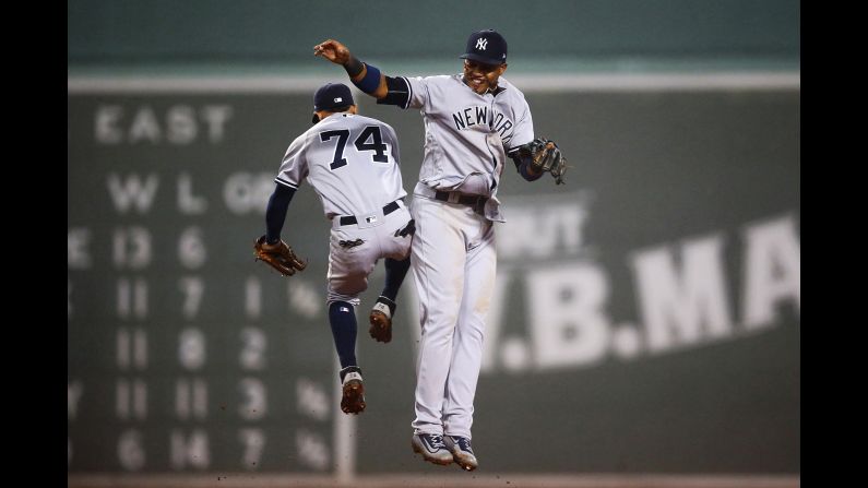Ronald Torreyes, left, and Aaron Judge celebrate after the New York Yankees won a game in Boston on Wednesday, April 26.