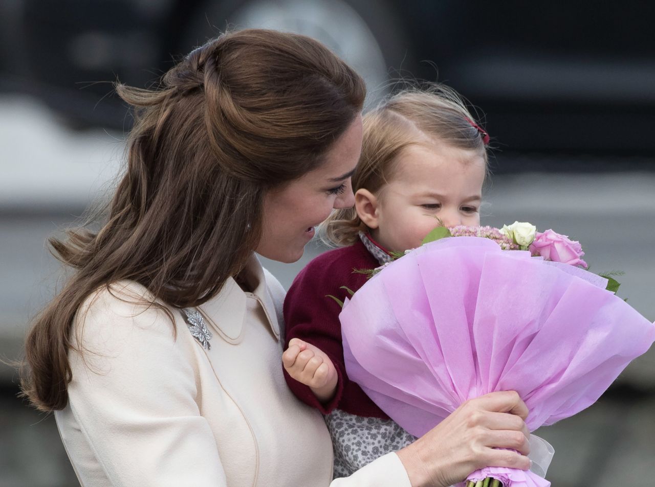 Catherine holds flowers for Charlotte to smell as they leave Victoria, British Columbia, in October 2016.