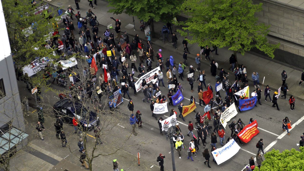 Protesters march through the streets in Portland, disrupting traffic.