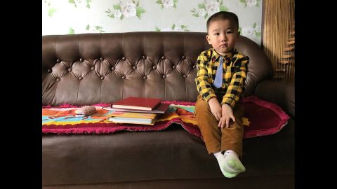 A North Korean boy sits in his family's living room on April 30 in Pyongyang.