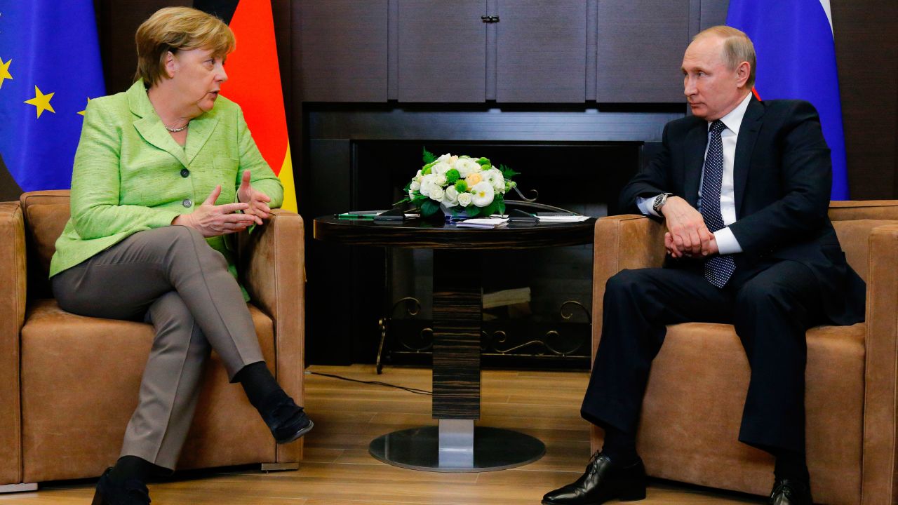 Merkel (L) with Putin at the Bocharov Ruchei residence in Sochi on Tuesday.
