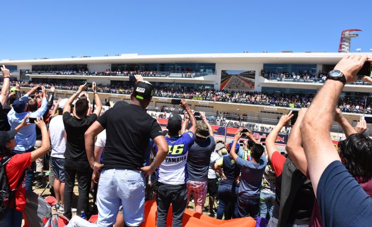 Crowds jostle for a glimpse of the MotoGP starting grid in Austin.
