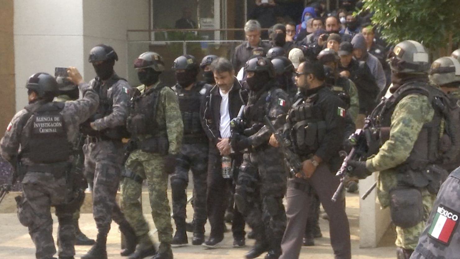  Dámaso López Nuñez is escorted by police after his capture at an apartment building in Mexico City. 