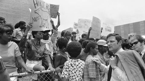 Sen. Birch Bayh, D-Indiana, passes demonstrators protesting the slayings of two African-Americans on the campus of Jackson State College in May 1970.