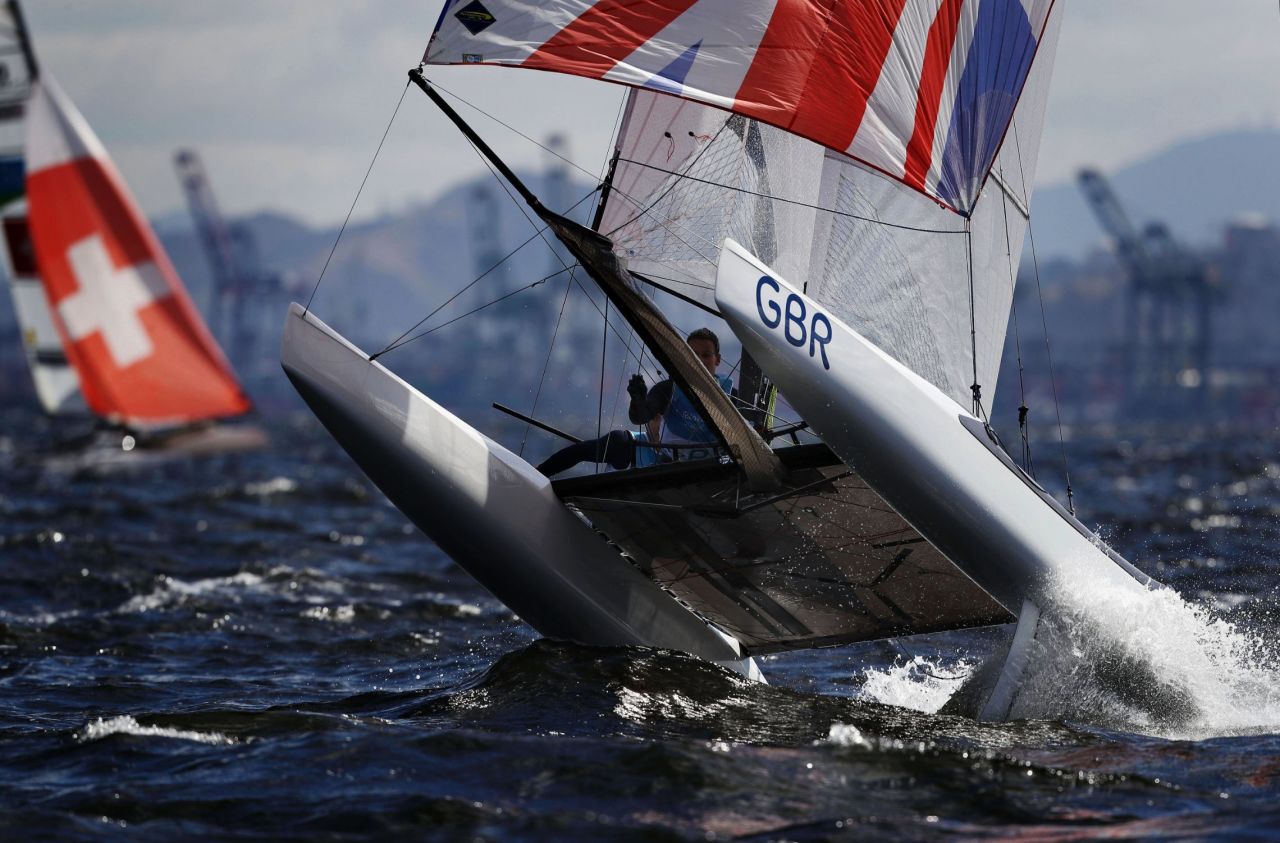 Mason describes the image of Scott's elation as "one the nicest, cleanest" he's ever taken -- telling CNN Sport  the ultimate aim is always "a picture that tells a story with a key moment, key athlete and beautiful light."  But sometimes it's about pure action. Here, a member of the Nacra 17 Olympic fleet fights with testing winds on the Rio waters.  
