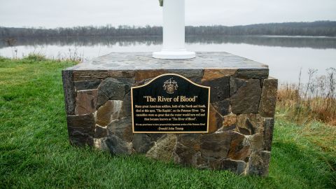 A plaque that reads "The River of Blood" sits at the base of a flagpole between the 14th and 15th hole at the Trump National Golf Club  in Sterling, Va., Wednesday, Dec. 2, 2015. The historical accuracy that "American soldiers, both of the North and South, died at this spot" has been called into question by historians. (AP Photo/Andrew Harnik)