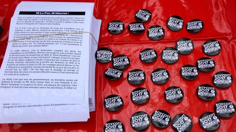 Boycott 2017 badges at a rally in Paris. Boycott 2017 is calling on voters to back neither candidate.