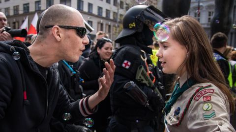 Girl Scout Lucie Myslíková, 16, squares off with a right-wing demonstrator.