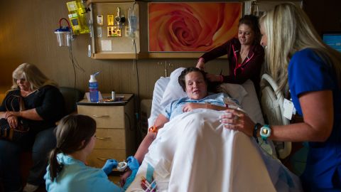 Jessica is surrounded by friends, family and hospital staff shortly before her C-section on April 20.
