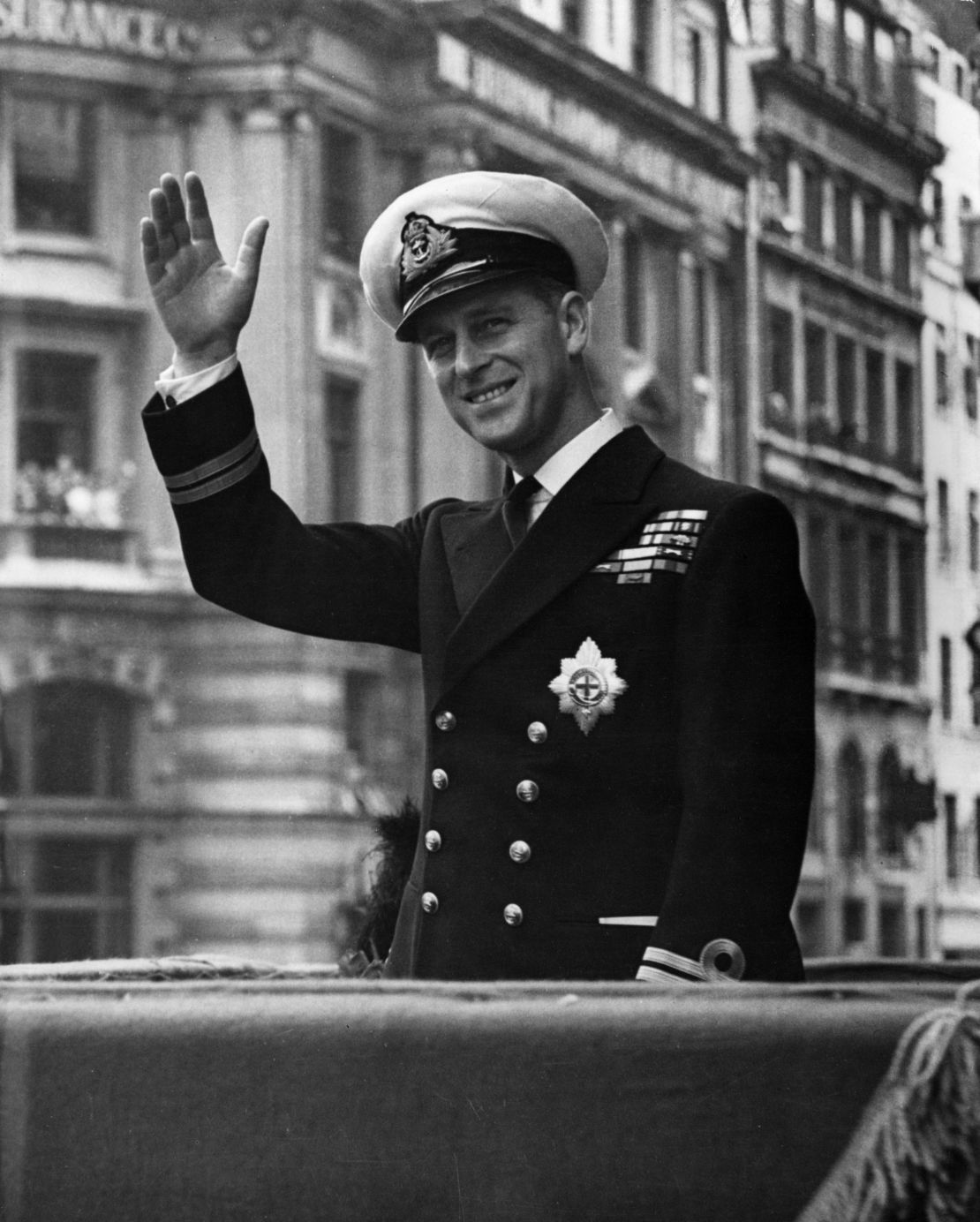 Prince Philip, Duke Of Edinburgh, waving through the open roof of a car on May 1948. 