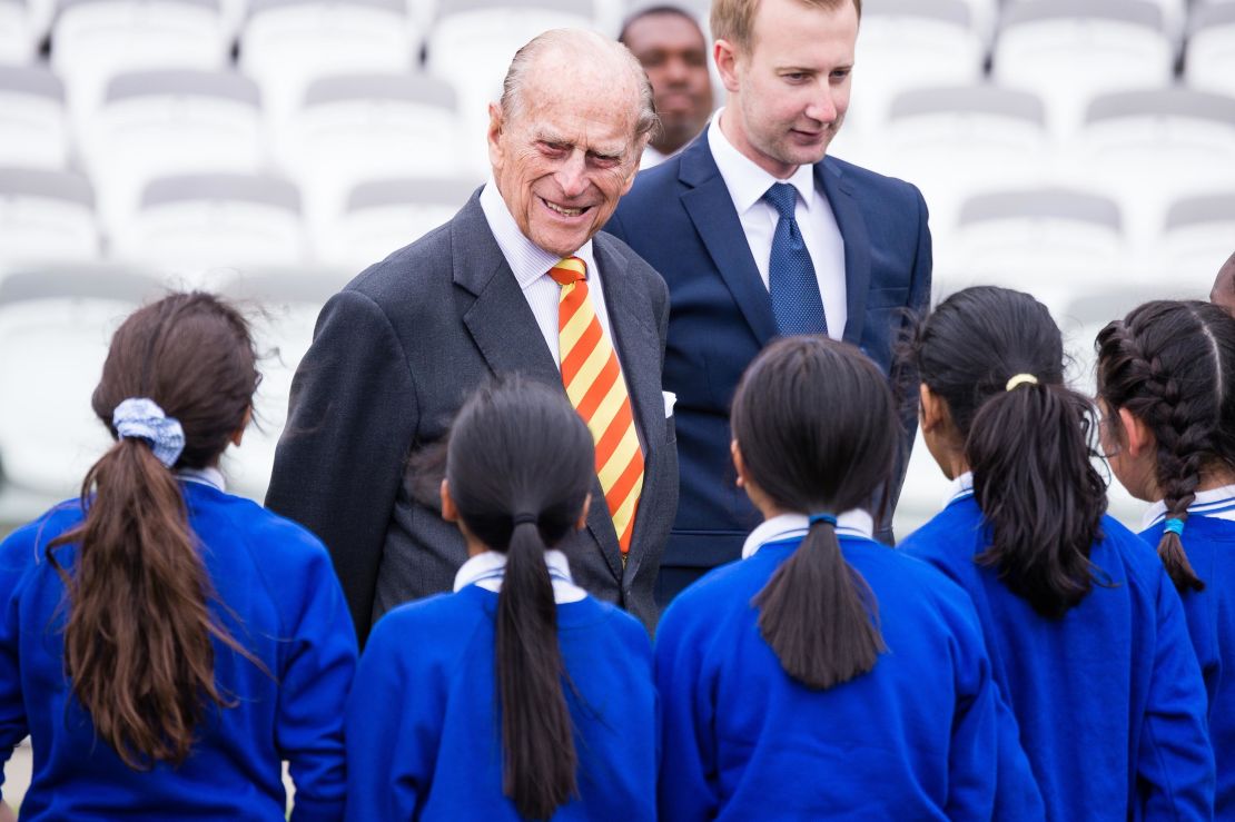 Prince Philip speaks to school children while opening the new stand at Lord's cricket ground.