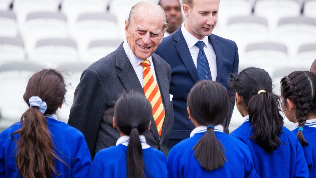 Prince Philip speaks to school children while opening the new stand at Lord's cricket ground.