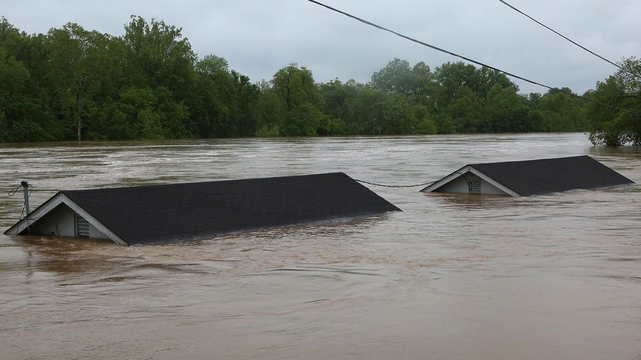 Two rental houses are nearly submerged next to the Meramec River on Opps Lane in Fenton, Missouri.