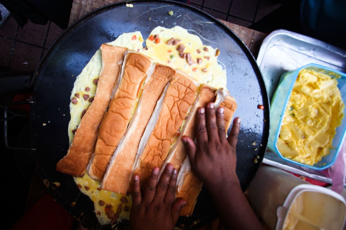 A Muslim trader prepares a Roti John during a Ramadan bazaar in Kuala Lumpur.