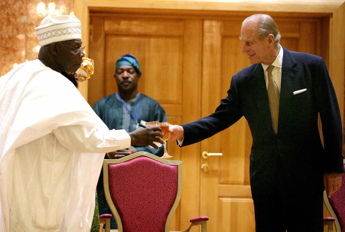 Prince Philip toasts then Nigerian President Olusegun Obasanjo in  Abuja, Nigeria in 2003.
