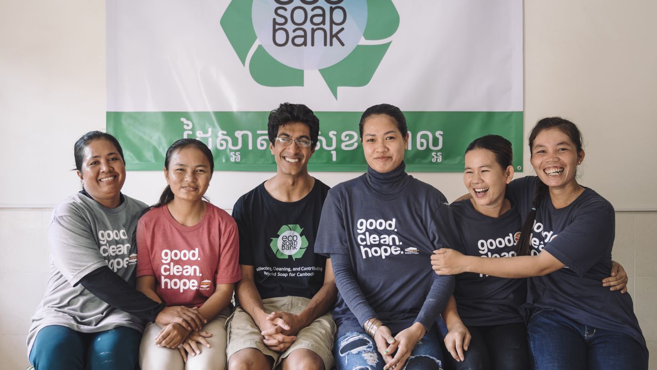 Lakhani shares a light moment with staff at Eco-Soap Bank--which employs local women