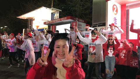 Supporters of South Korean presidential candidate Hong Jun-pyo perform outside a TV station prior to a televised debate.