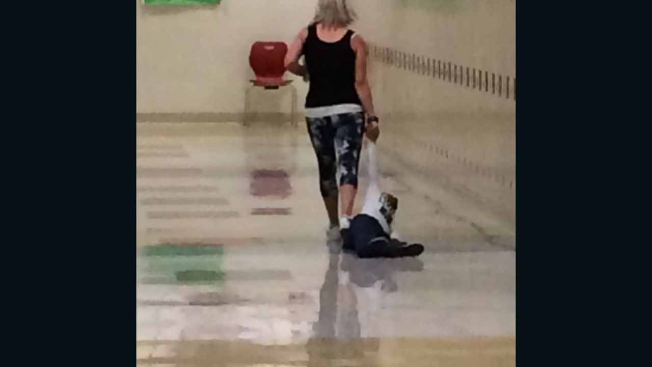 An Ohio Head Start teacher was fired after a colleague snapped this photo of the woman dragging a young student down a hallway Tuesday. 