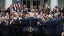 President Donald Trump (C) congratulates House Republicans after they passed legislation aimed at repealing and replacing ObamaCare, during an event in the Rose Garden at the White House, on May 4, 2017 in Washington, DC. 