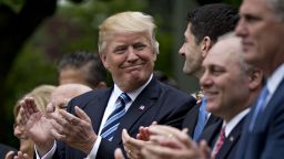 U.S. President Donald Trump, center, applauds while standing next to U.S. House Speaker Paul Ryan, a Republican from Wisconsin, center right, during a press conference in the Rose Garden of the White House in Washington, D.C., U.S., on Thursday, May 4, 2017. House Republicans mustered just enough votes to pass their health-care bill Thursday, salvaging what at times appeared to be a doomed mission to repeal and partially replace Obamacare under intense pressure from Trump to produce legislative accomplishments. Photographer: Andrew Harrer/Bloomberg via Getty Images