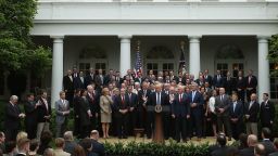 President Donald Trump speaks on May 4 while flanked by House Republicans after they passed health care legislation.