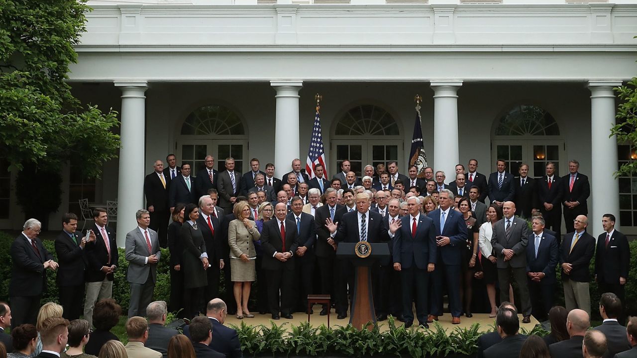 President Donald Trump speaks while flanked by House Republicans after they passed legislation last week aimed at repealing and replacing Obamacare.