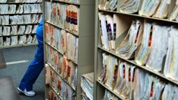 A staff member walks past medical records at the Cornerstone Care Community Health Center of Rogersville March 21, 2017 in Rogersville, Pennsylvania.
The Republican-controlled House of Representatives votes Thursday on a key plank of Trump's legislative agenda -- his plan to repeal and replace Obamacare, his predecessor's crowning domestic policy achievement.