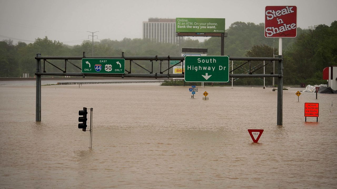 Exit signs on Highway 141 near the Meramec River are submerged on May 4, in Valley Park, Missouri.